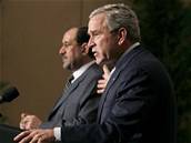 George Bush s Núrím Málikím.