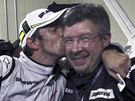 Jenson Button (vlevo) a Ross Brawn