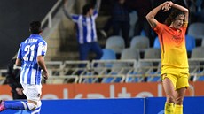 AL. Soupei z Realu Sociedad slaví a kapitán Carles Puyol (vpravo) ví, e jeho