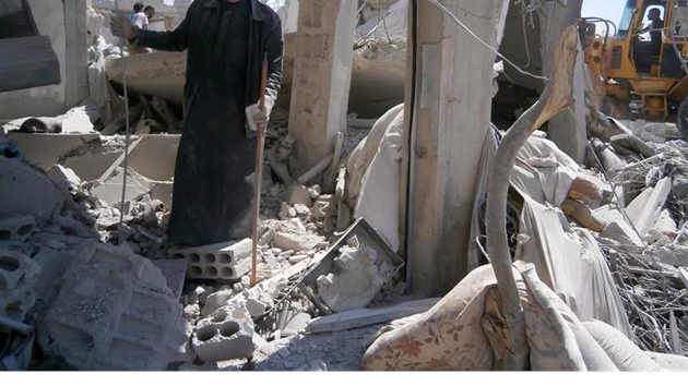 Trosky msta Kusajr, kter o vkendu dobyla syrsk armda spolu s bojovnky Hizballhu (20. kvtna 2013)