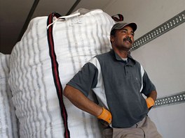 Farm worker Mustapha El-Mezroui waits to load a sack filled with potatoes onto...