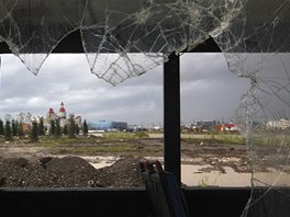 A view of Olympic venues and accommodation complex is seen through the window...