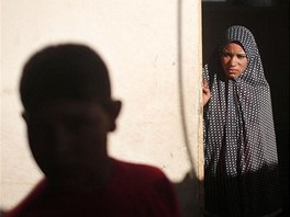 Newly married Tala Soboh, 14, looks at her 15-year-old husband Ahmed two days...