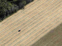 A tractor works on a wheat plantation on land that used to be virgin Amazon...