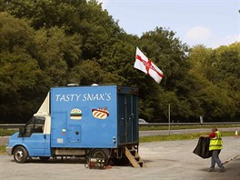 A truck driver walks towards a snack van along the A22 near Caterham, southern...