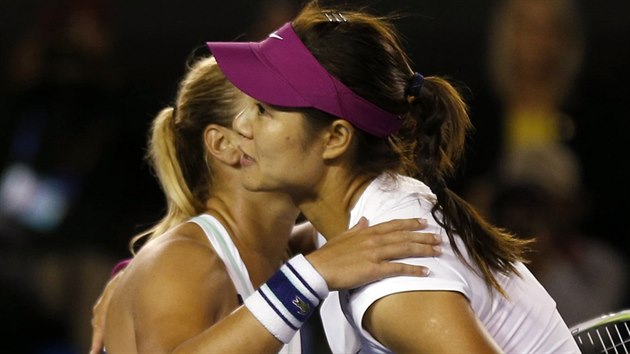 Li Na of China and Dominika Cibulkova of Slovakia hug after their women's singles final match at the Australian Open 2014 tennis tournament in Melbourne