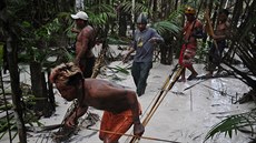 Munduruku Indian warriors search for illegal gold mines and miners in their...