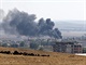 Ze syrskho Kobani stoup hust dm (6. jna 2014).