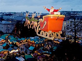 High wire performer Falko Traber poses as the "Flying Santa" on his motorcycle...