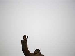A combination picture shows a statue of China's late Chairman Mao Zedong on a...