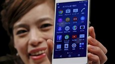 A model poses with Sony's new Xperia Z4 smartphone after a news conference in...