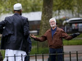 A man gestures during a speech by Muslim speaker Osman (C) at Speakers' Corner...