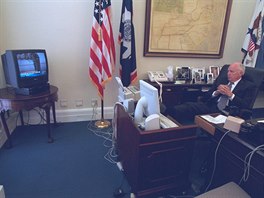 U.S. Vice President Dick Cheney watches television reports in Washington in the...