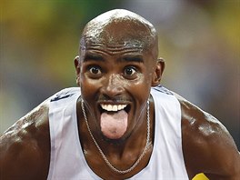 Mo Farah of Britain celebrates winning the men's 10,000 metres final at the...