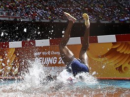 Rolanda Bell of Panama falling head first into the water obstacle during the...