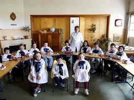 Teacher Ana Dorrego poses with students of the rural school Agustin Ferreira on...