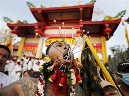 A devotee of the Chinese Jui Tui shrine walk with spikes pierced on his cheeks...