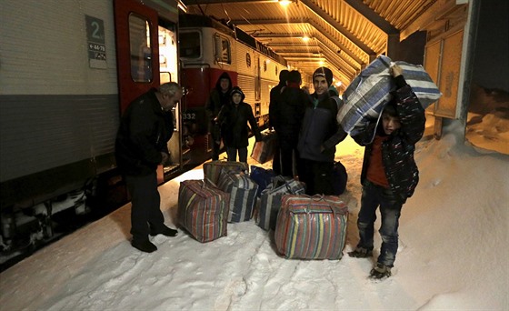 Migranti na severu védska ve mst Riksgransen. (19. prosince 2015)