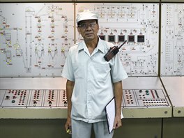 Thongdee Saenghow, a 62-year-old production supervisor, poses for a portrait...