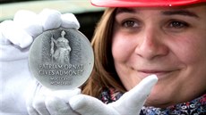 Pamtní medaile nalezená ve schránce v makovici hlavní ve Národního muzea....