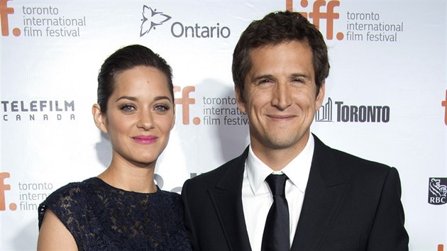 Marion Cotillardov a Guillaume Canet (Toronto, 9. z 2013)