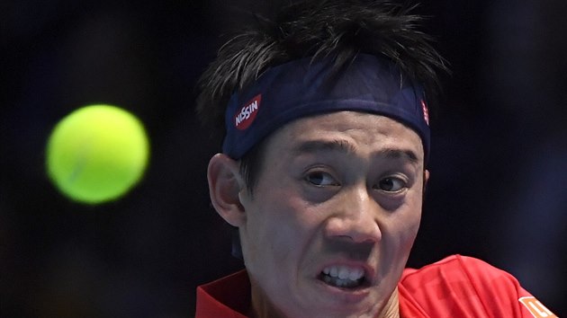 Japonsk tenista Kei Niikori v duelu s Marinem iliem z Chorvatska.,