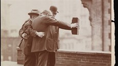 Five photographers on the roof of Colonel Marceau's photography studio prepare...