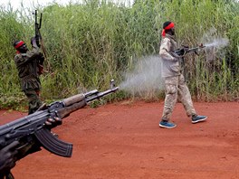 SPLA-IO (SPLA-In Opposition) rebels return fire as they march after an assault...