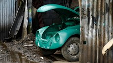 A Volkswagen Beetle car is seen inside a painting room at a garage in Addis... A Volkswagen Beetle car is seen inside a painting room at a garage in Addis...