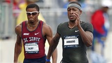 Sprinter Mike Rodgers (vpravo) dobíhá do cíle běhu na 100 metrů na mistrovství... Sprinter Mike Rodgers (vpravo) dobíhá do cíle běhu na 100 metrů na mistrovství...