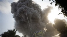 Smoke raises in the background following an Israeli airstrike hits a... Smoke raises in the background following an Israeli airstrike hits a...