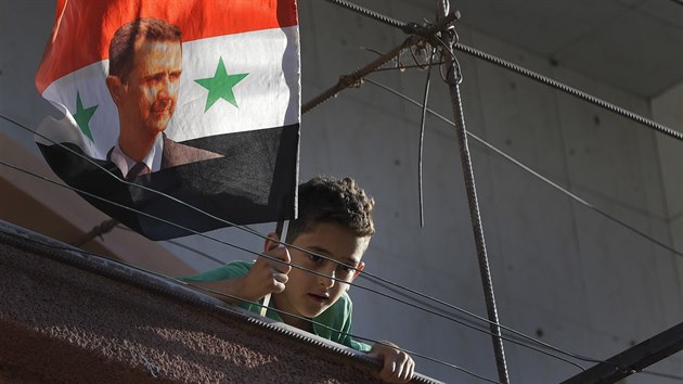 Damaek. Syrsk chlapec s portrtem Bara Asada  (16. srpna 2018)