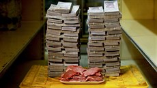 A kilogram of meat is pictured next to 9,500,000 bolivars, its price and the... A kilogram of meat is pictured next to 9,500,000 bolivars, its price and the...