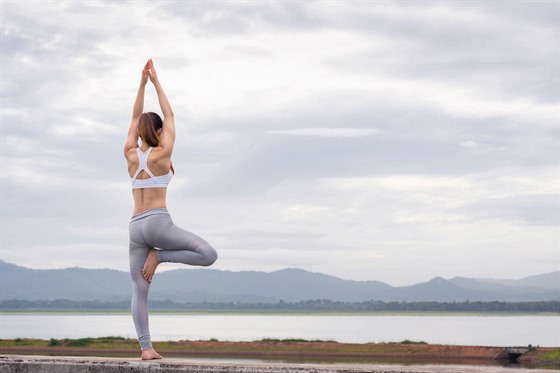 Asia woman doing yoga fitness exercise