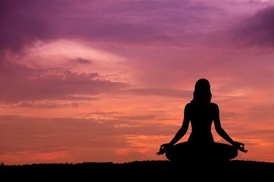 Silhouette of a beautiful Yoga woman