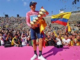 Ecuador Richard Carapaz poses with a trophy for the winner of Giro Cycling ...