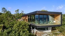Holistická architektura důsledně boří bariéry mezi okolní krajinou a domem. Holistická architektura důsledně boří bariéry mezi okolní krajinou a domem.