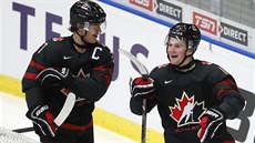 Kanaďan Alexis Lafreniere (vpravo) oslavuje svoji trefu v semifinále MS hráčů... Kanaďan Alexis Lafreniere (vpravo) oslavuje svoji trefu v semifinále MS hráčů...