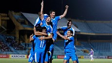 Fotbalisté turkmenského klubu Altyn Asyr se radují z gólu v zápase s FC Hanoj v... Fotbalisté turkmenského klubu Altyn Asyr se radují z gólu v zápase s FC Hanoj v...