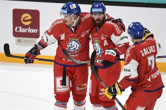 etí hokejisté Andrej Nestrail, Filip Hronek a Jakub Galvas (zleva) se radují...