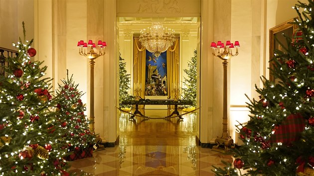 The Cross Hall leading to the East Room of the White House is decorated during the 2020 Christmas preview, Monday, Nov. 30, 2020, in Washington. (AP Photo/Patrick Semansky)