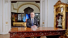 Premiér Petr Fiala při natáčení novoročního projevu. Premiér Petr Fiala při natáčení novoročního projevu.
