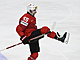 výcarský obránce Romain Loeffel slaví gól do sít Kanady.