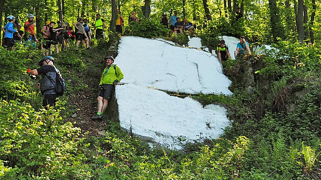 Bílý kámen je pravidelně natíraný skalní výchoz bývalého lomu s výhledem na Olomouc. Na jaře odpoledne, když svítí slunce, bývá Bílý kámen vidět z dálnice D35 za Olomoucí směrem na Ostravu jako zářící bělostný bod v lese.