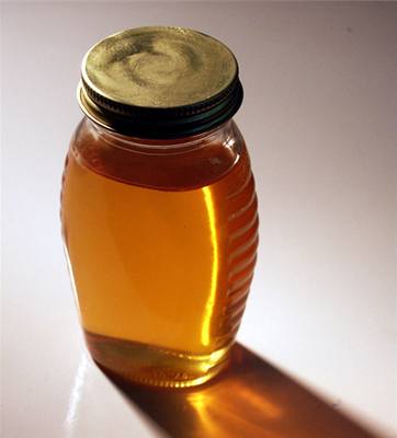 Sklenice medu - ilustraní foto.
