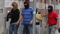 Policisté přivádějí zadrženou nejbližší spolupracovnici premiéra Petra Nečase Janu Nagyovou na policejní služebnu v ostravské Masné ulici. | na serveru Lidovky.cz | aktuální zprávy