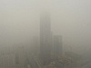 Smogov mlha ve mst en-jang v provincii Liao-ning 