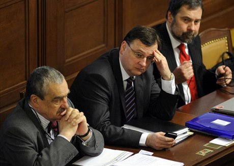 Prime Minister Petr Neas (center) survives another day