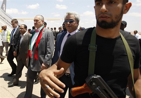 Foreign Minister Karel Schwarzenberg (wearing a scarf comprised of the Libyan national colors) arrives on a fact finding and humanitarian mission to the rebels