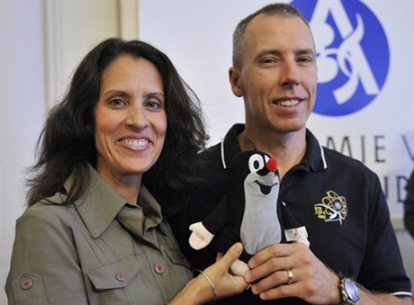 US astronaut Andrew Feustel (right) with his wife, Indira, in Prague on Monday with his furry Czech friend and fellow space shuttle mission veteran Krtek